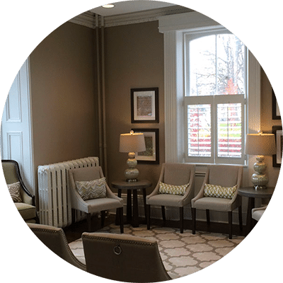 Dental lobby with soft lighting and gray chairs