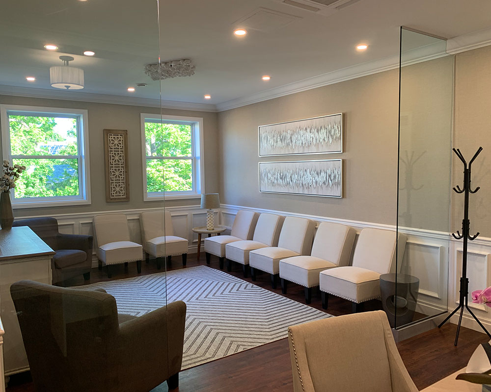 Lobby seating area with several cream chairs